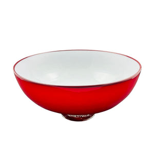 Red glass bowl with white interior on a white background